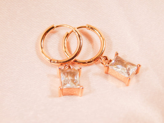 Rose gold hoop earrings with rectangular clear crystal pendants