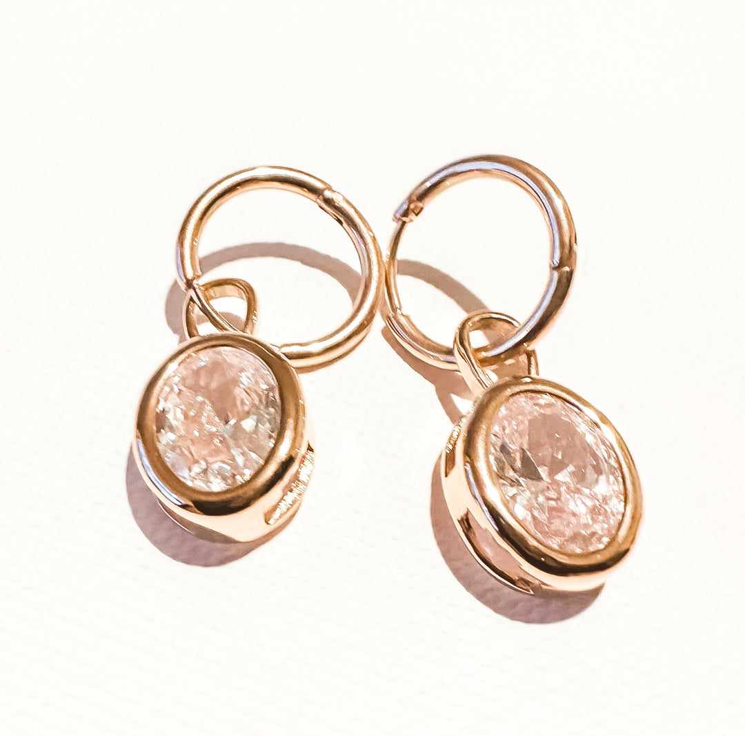 Tiny crystal ball flat back earring in silver, offering a subtle shine