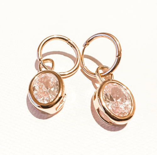 Tiny crystal ball flat back earring in silver, offering a subtle shine