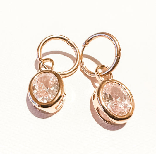 Tiny crystal ball flat back earring in silver, offering a subtle shine