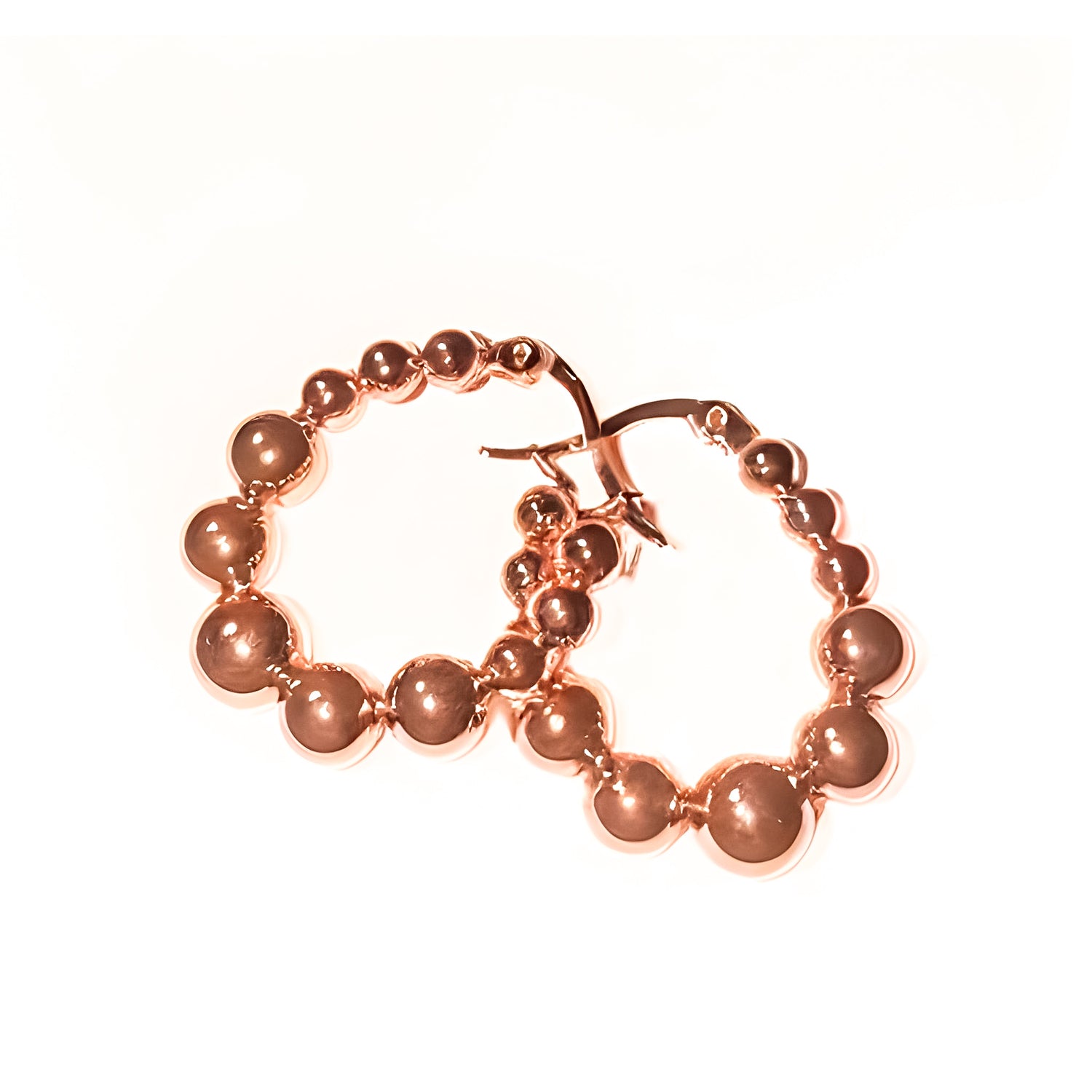 Model wearing layered rose gold necklaces